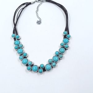 Signed Sweet Lola  features 8-stranded leather with faux turquoise Stones